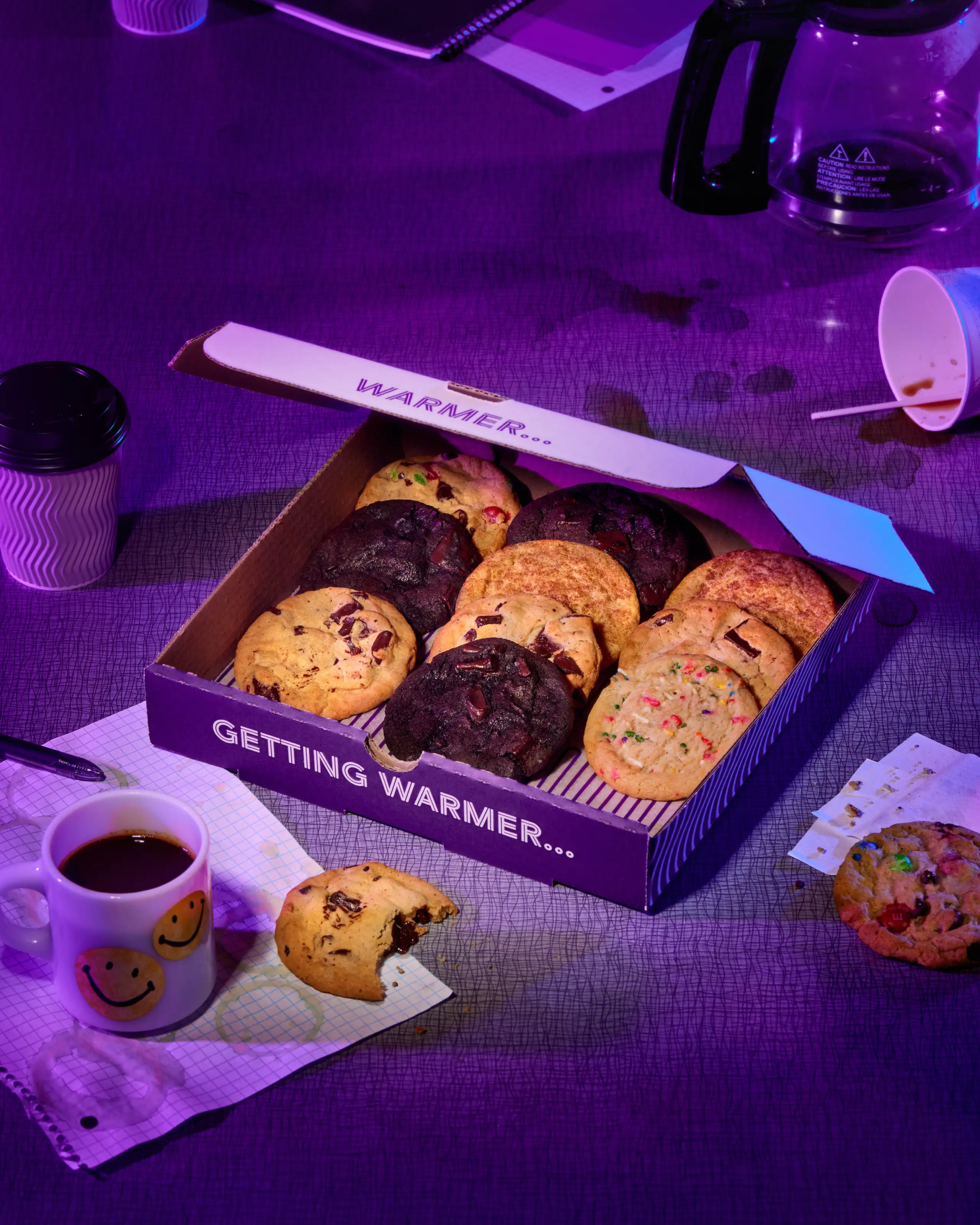 Box of cookies with study materials around