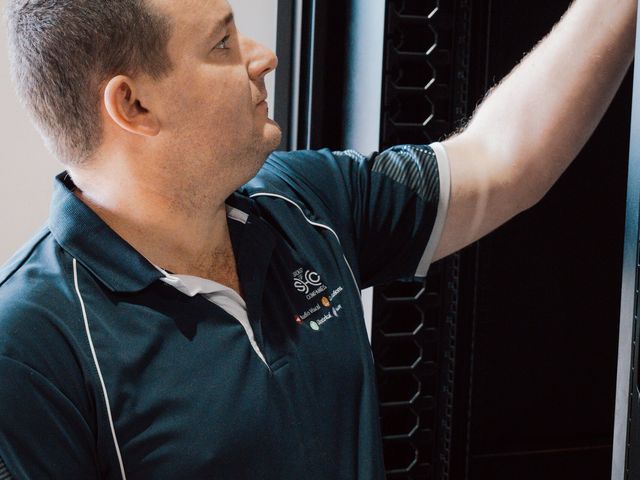 Team member working on a data rack