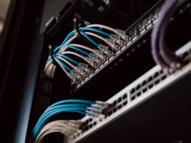 Patch cords connected to a patch panel and network switch