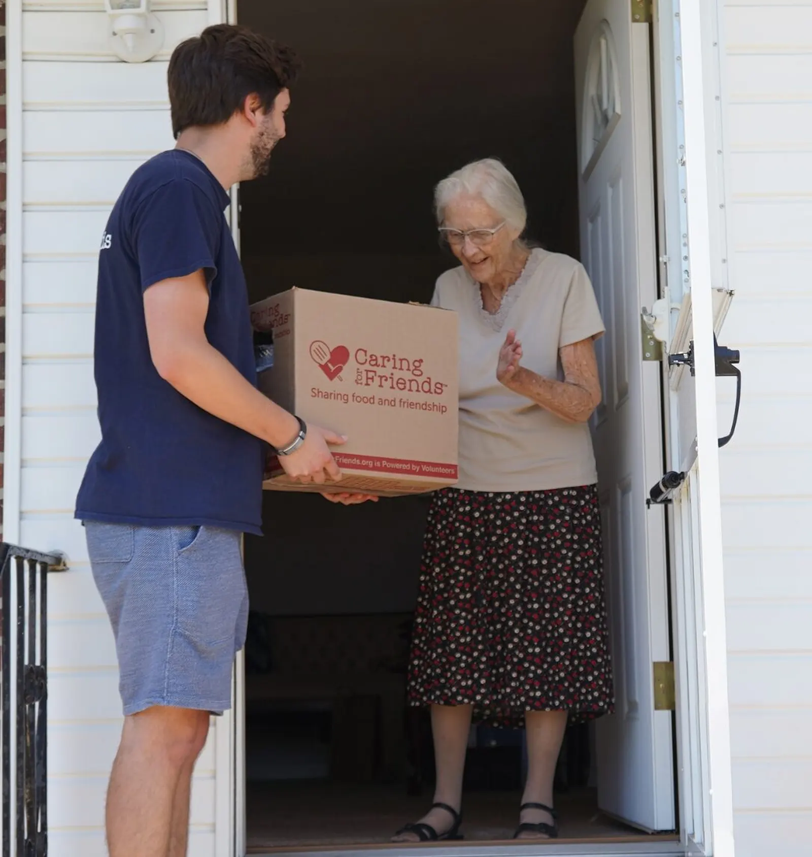 Caring for Friends volunteers organizing food donations