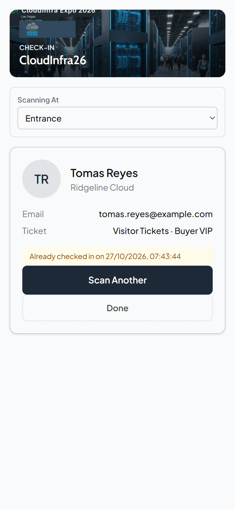 Phone check-in screen warning that Tomas Reyes was already checked in on 27/10/2026 at 07:43:44
