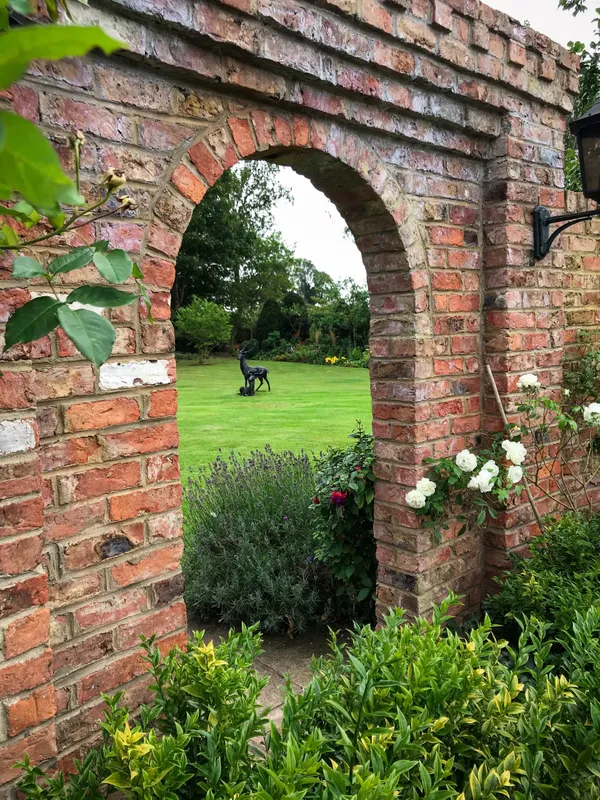 A kitchen garden with raised beds and perennial borders in Wetherby
