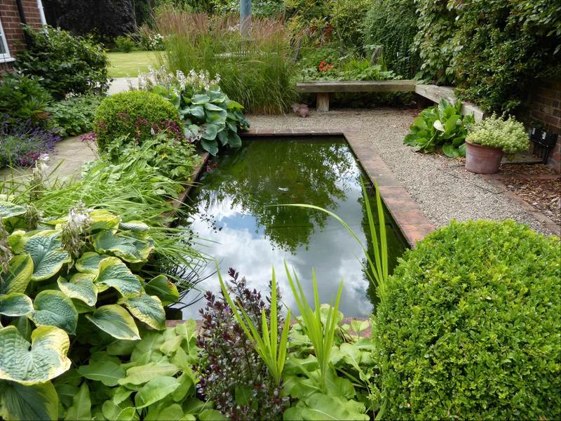 Lush green foliage planting with hostas in a shaded garden