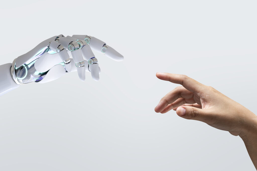remake moderno della creazione di adamo, una mano umana e una robotica che sta a rappresentare l'intelligenza artificiale 