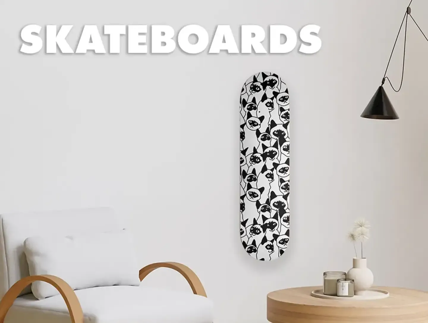 Skull pattern skateboard deck hanging on wall above sofa labelled 'Skateboards'.
