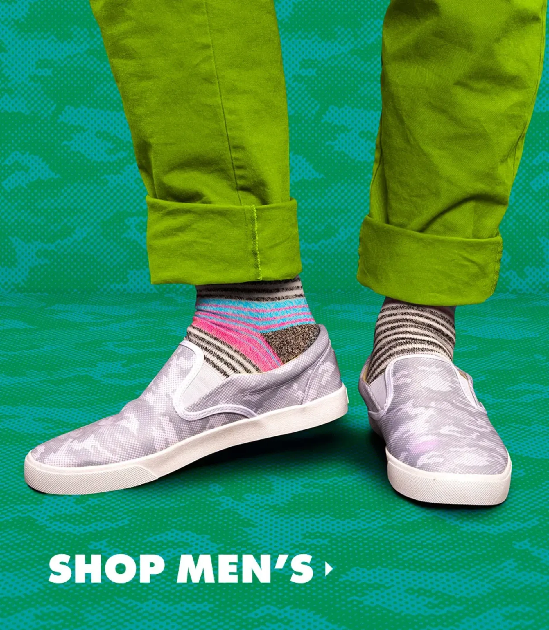 Man in lime green pants wearing grey camo men's slip-on shoes on a green patterned backdrop