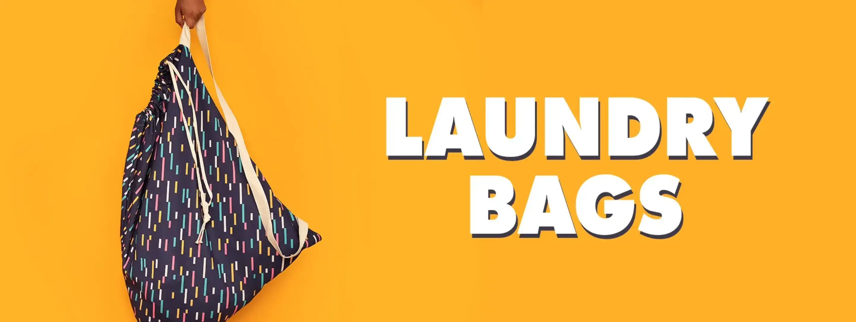 Dark confetti pattern laundry bag held up against orange background with 'Laundry Bags' text.