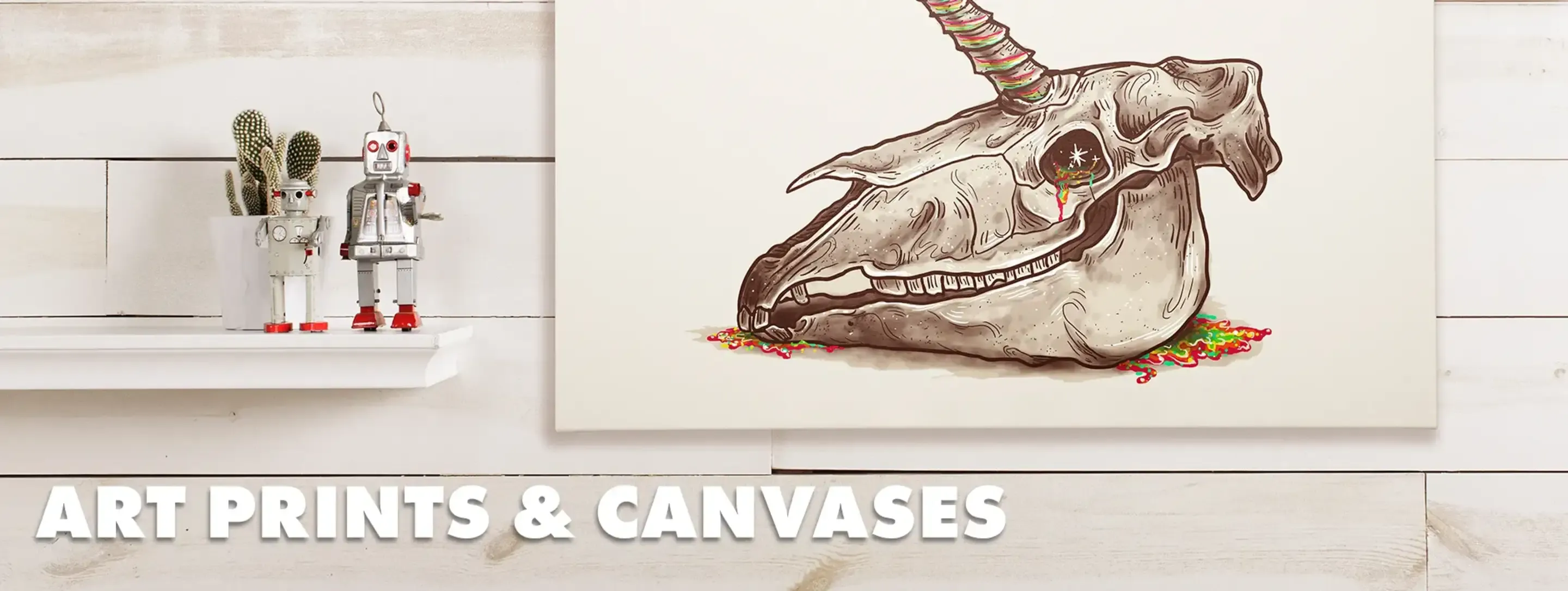 Framed canvas of horse skull illustration on shelf with cactus and toy robots, labelled 'Art Prints & Canvases'.