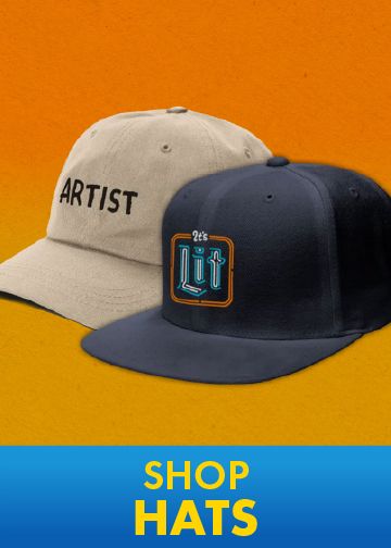 Tan and navy baseball hats with embroidered graphic designs on an orange background