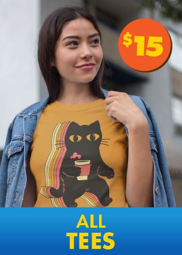 Woman in a yellow graphic t-shirt with a black cat design under a denim jacket