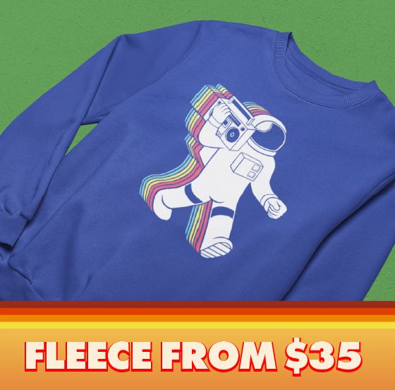 Blue crewneck sweatshirt with Funkalicious' retro astronaut graphic on a green background