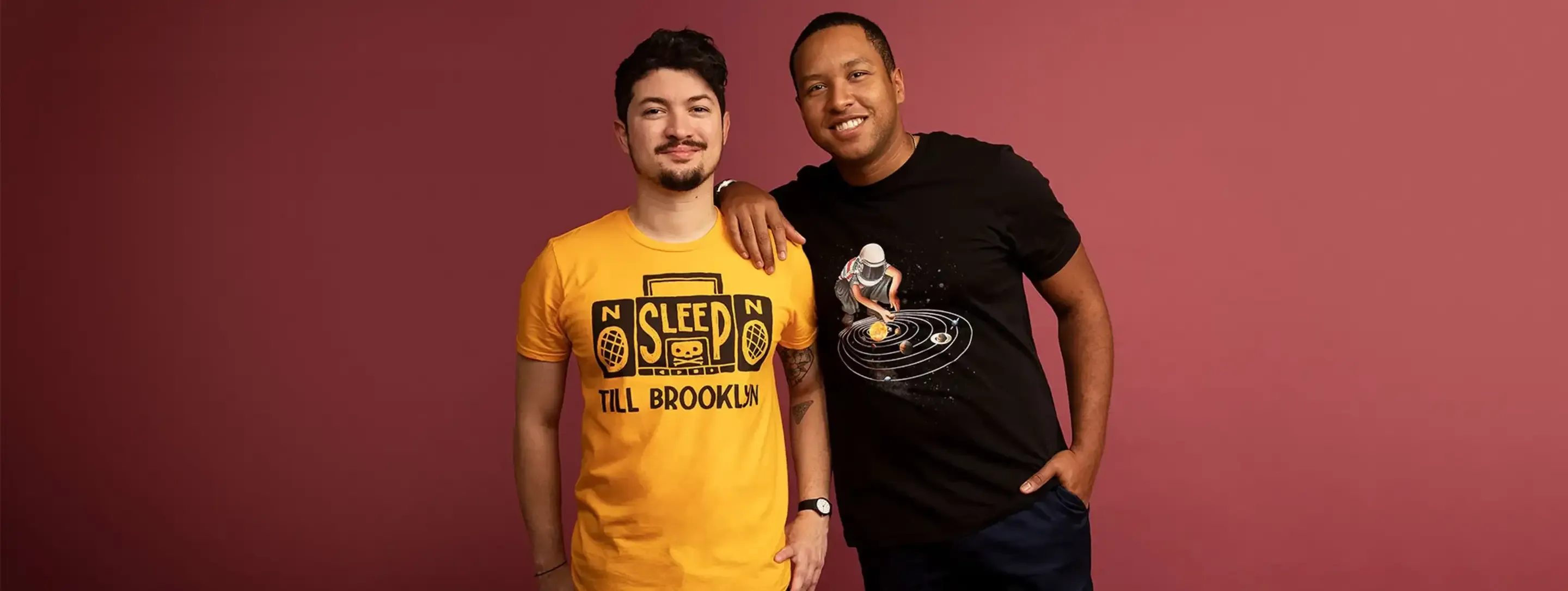 Two men wearing artist-designed graphic t-shirts from Threadless