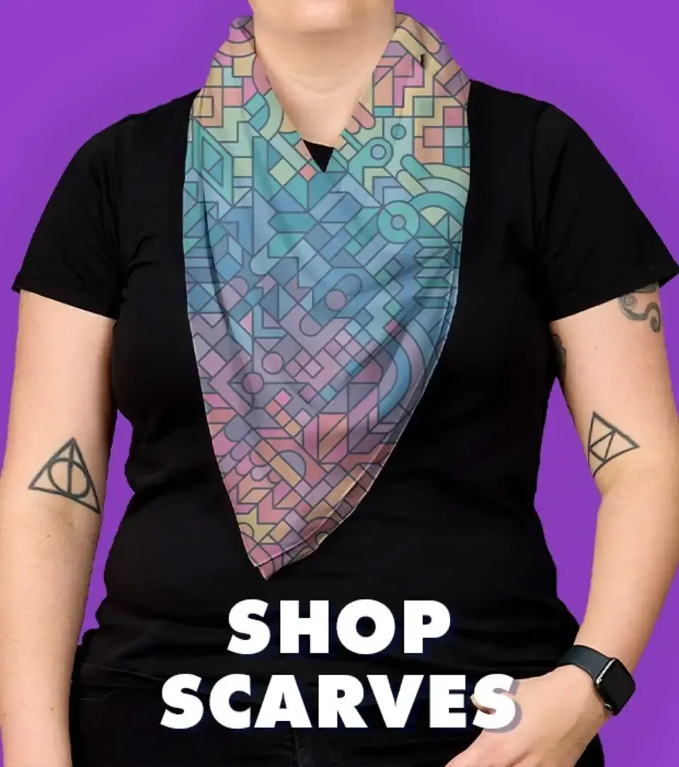 Tattooed person wearing geometric print bandana scarf with black t-shirt on purple backdrop.