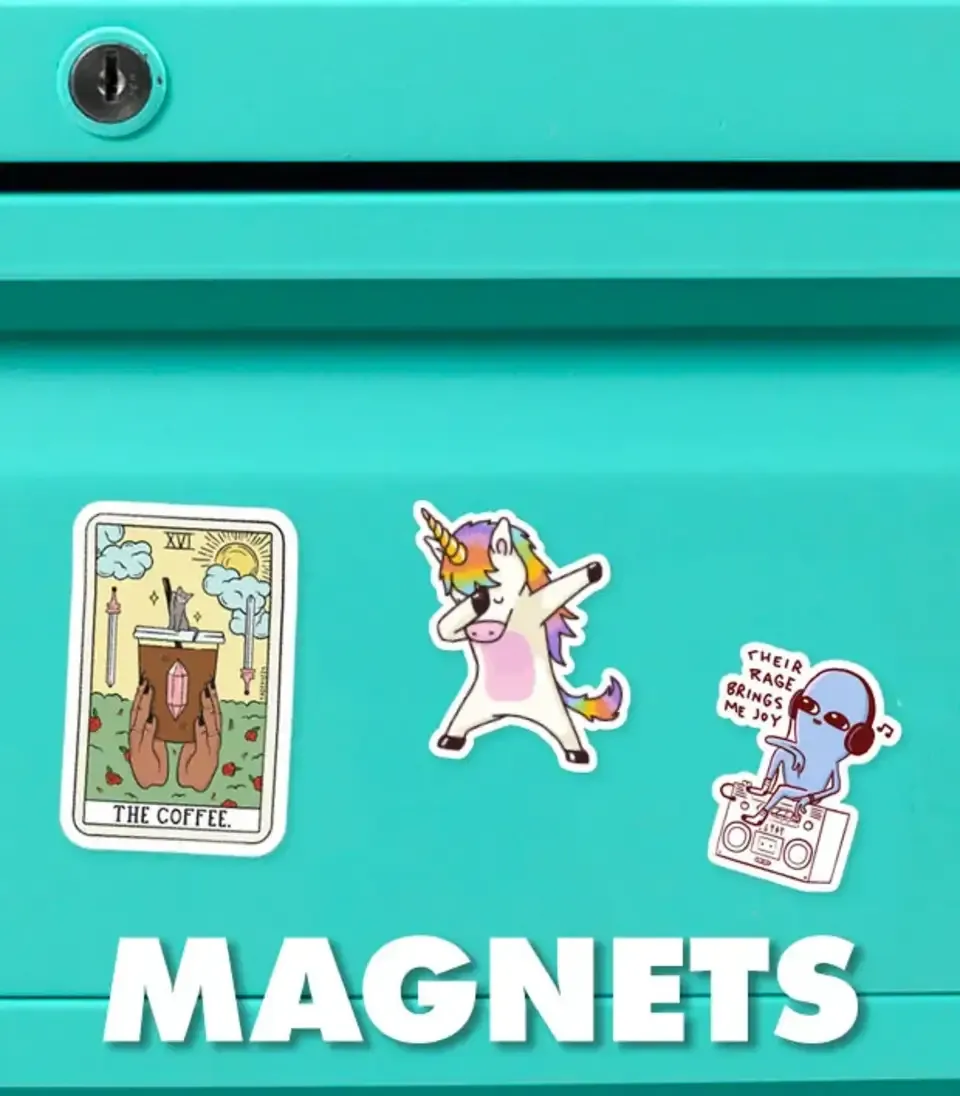 Tarot, dabbing unicorn and cat magnet set on teal refrigerator door with 'Magnets' text.