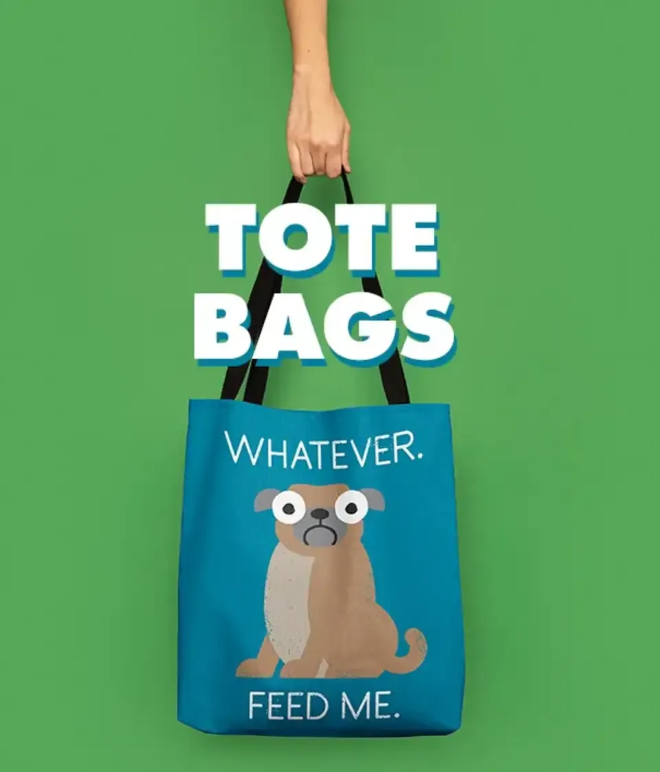 Blue pug 'Whatever Feed Me' tote bag held against green wall with 'Tote Bags' text.