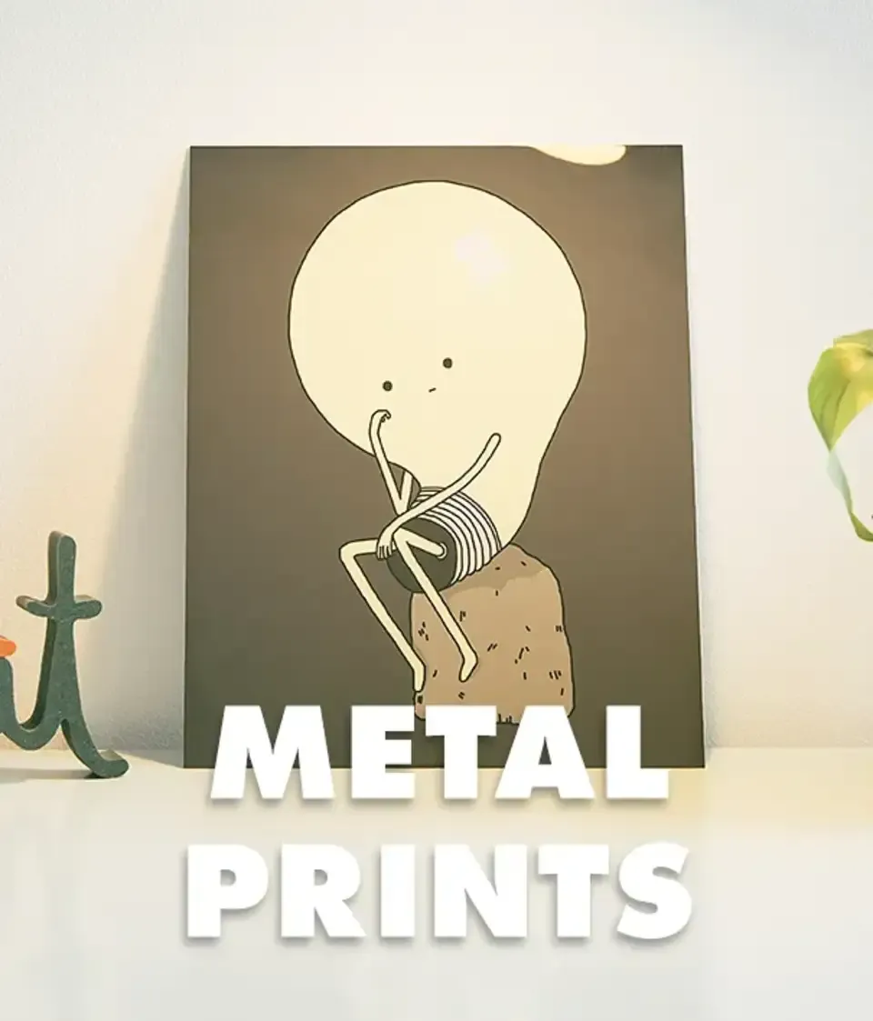 Metal print of skeleton lightbulb illustration leaning against beige wall labelled 'Metal Prints'.