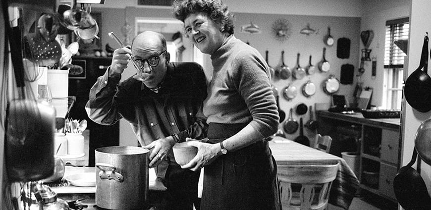 Julia and Paul Child in the kitchen