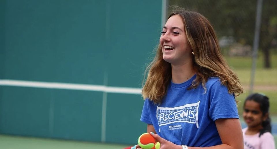 Lucy Erickson feeding tennis balls at a RecTennis Summer Camp in Oregon