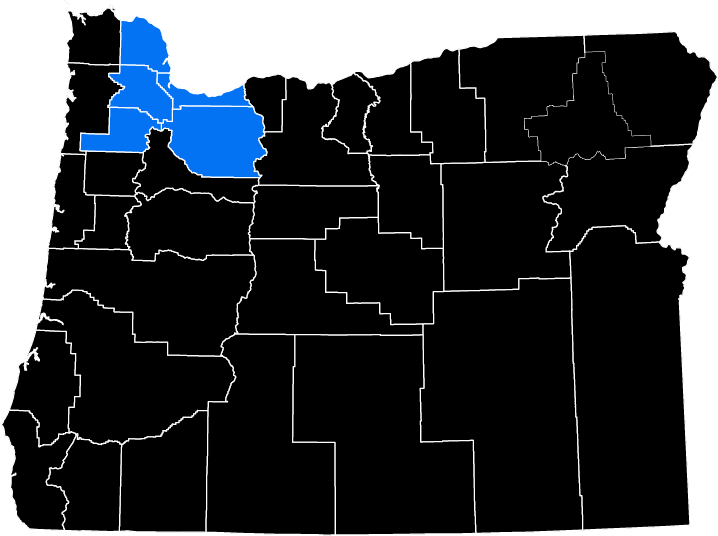 Map highlighting several counties in northwestern Oregon in blue against a black background.