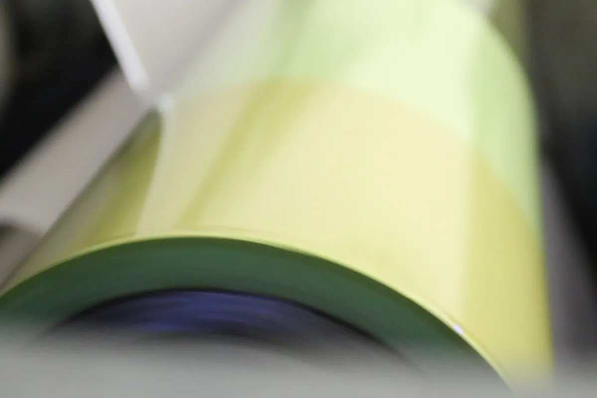 Paper rolls running through coating line at the GMLUK factory