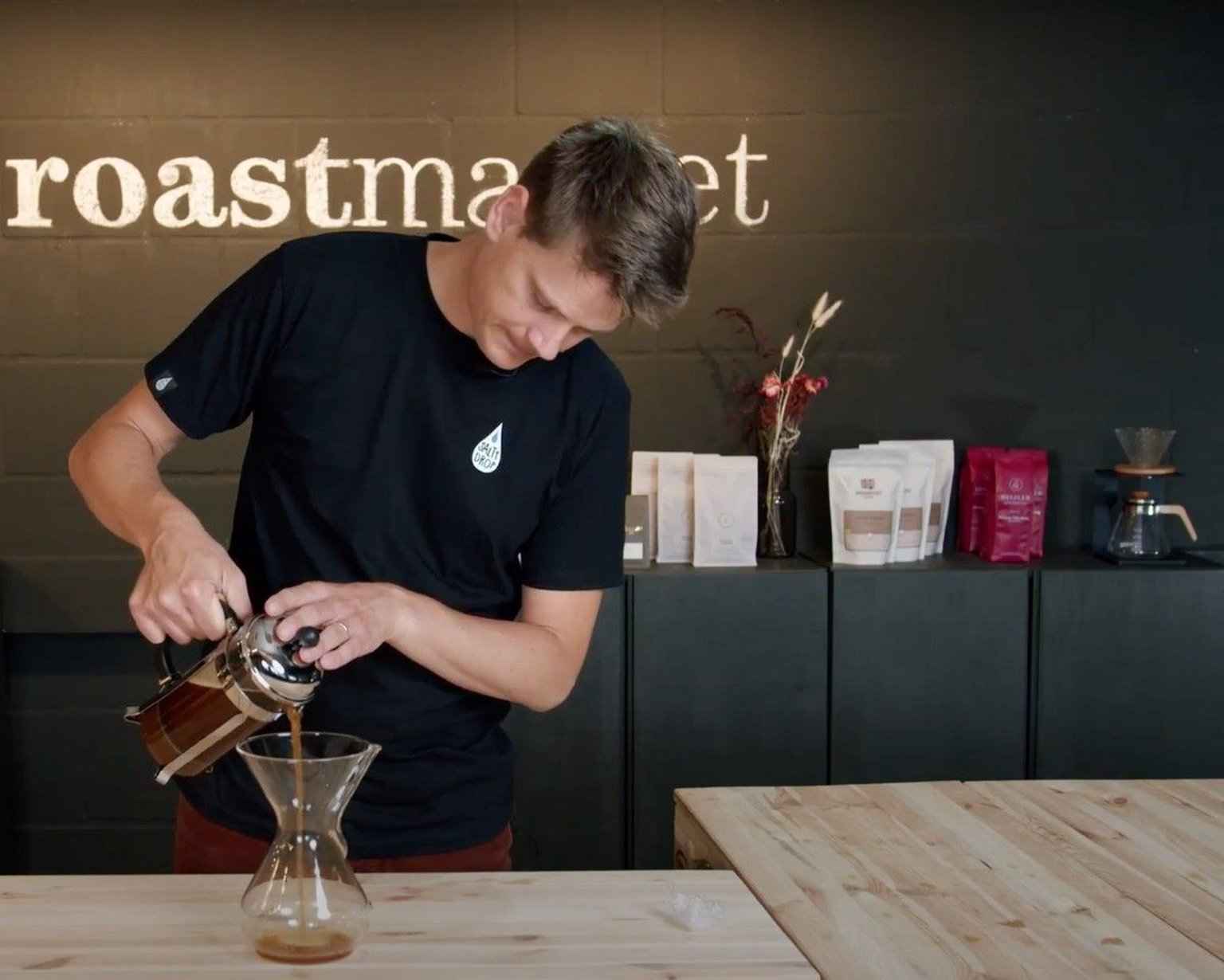 man putting Cold brew coffee in a jug
