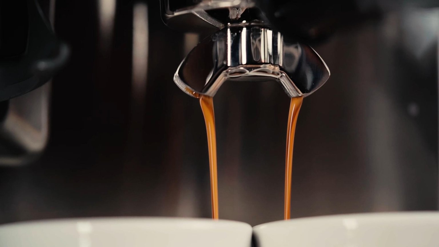 Coffee beans and brewed coffee with rich chocolate notes.