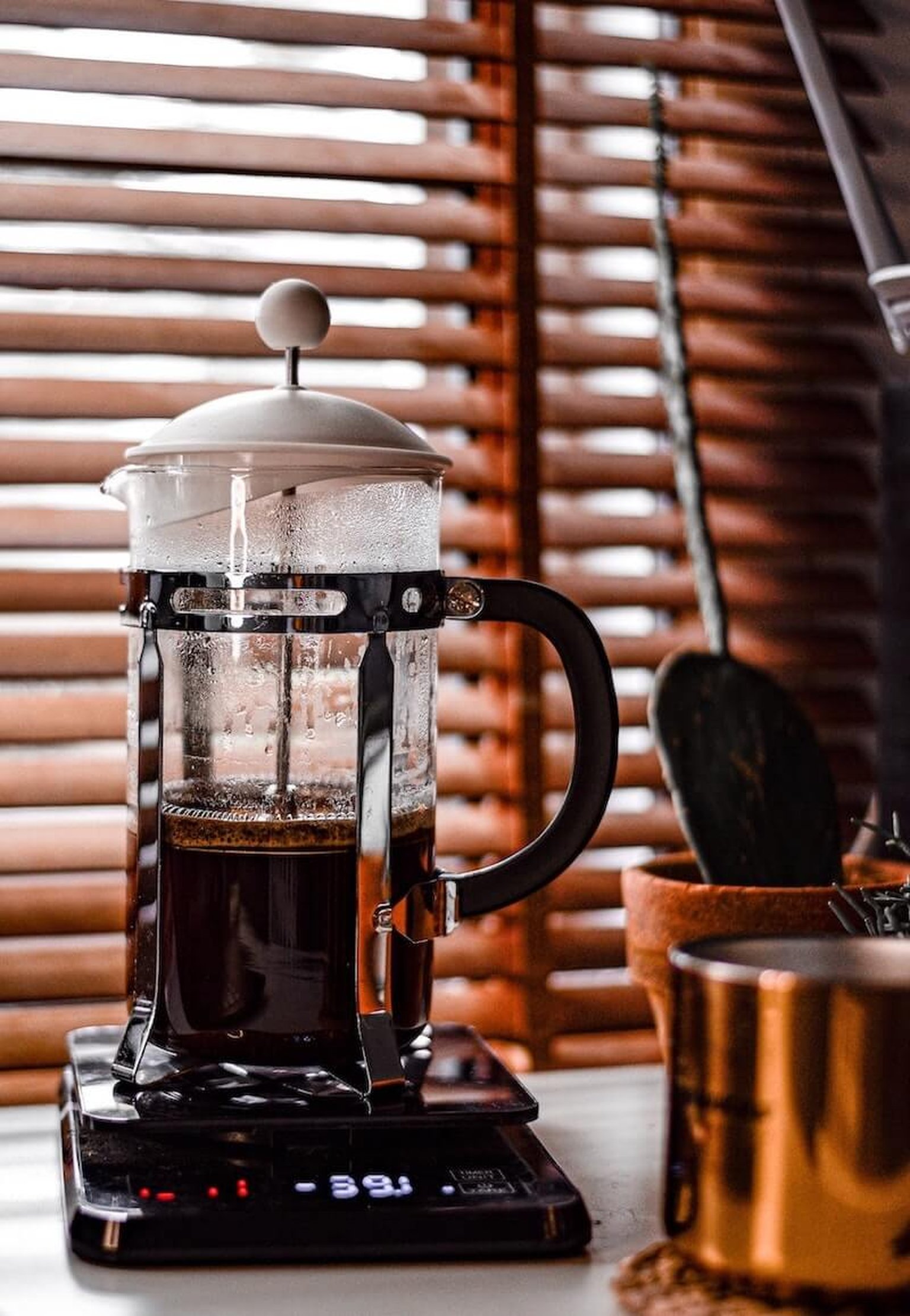 frnechpress can on a coffee scale