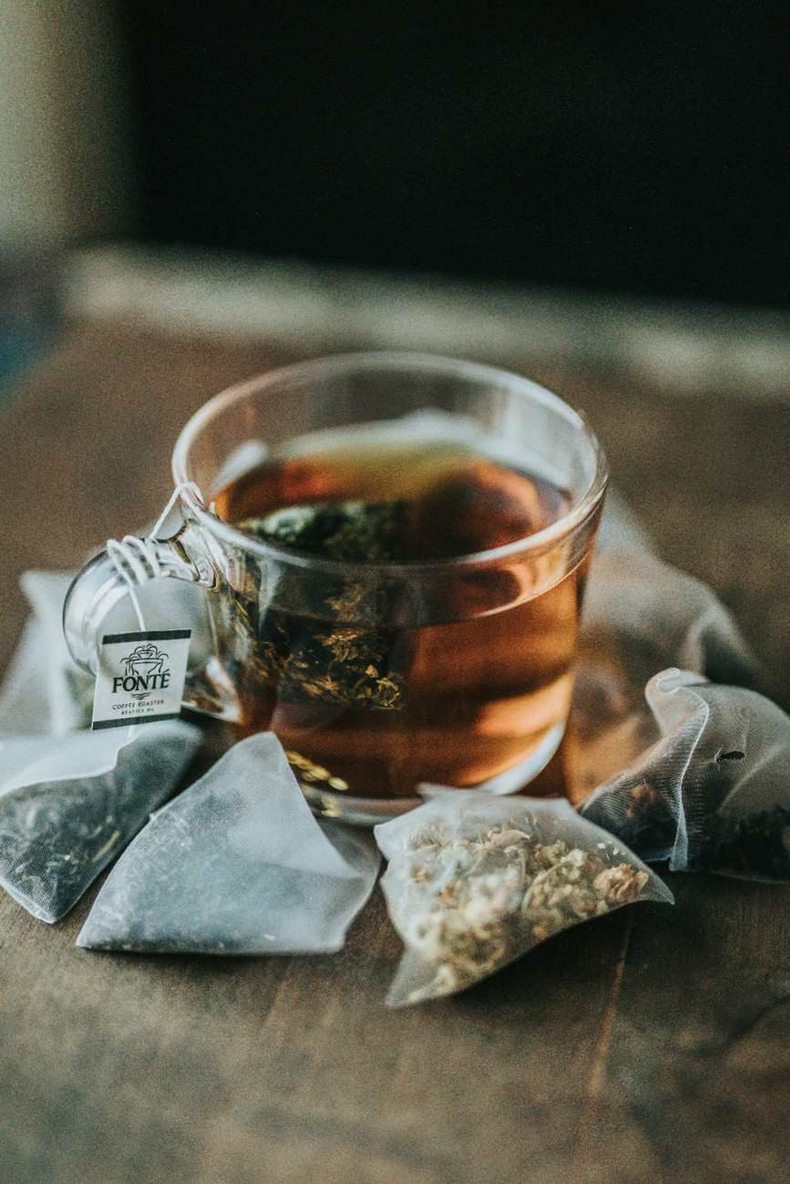 Tea leaves and tea accessories arranged for a premium tea ritual.