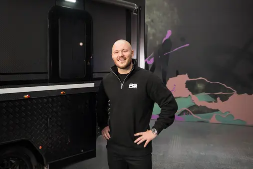 RS Rewards director in black branded hoodie at the RS Rewards headquarters