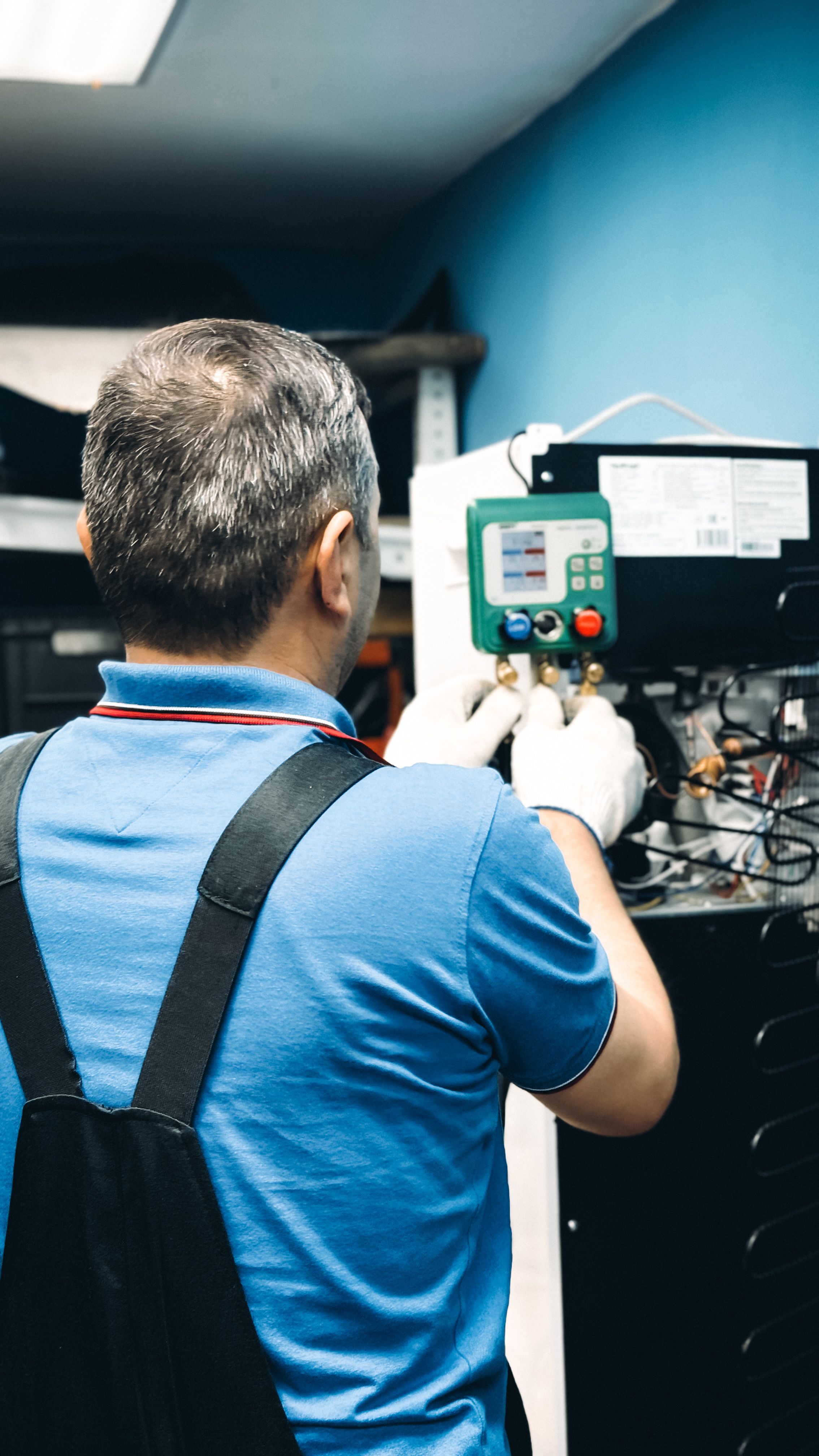 HVAC technician explaining maintenance recommendations, system upgrades, indoor air quality solutions, and repair options to a homeowner during a service visit to increase customer value and revenue opportunities.