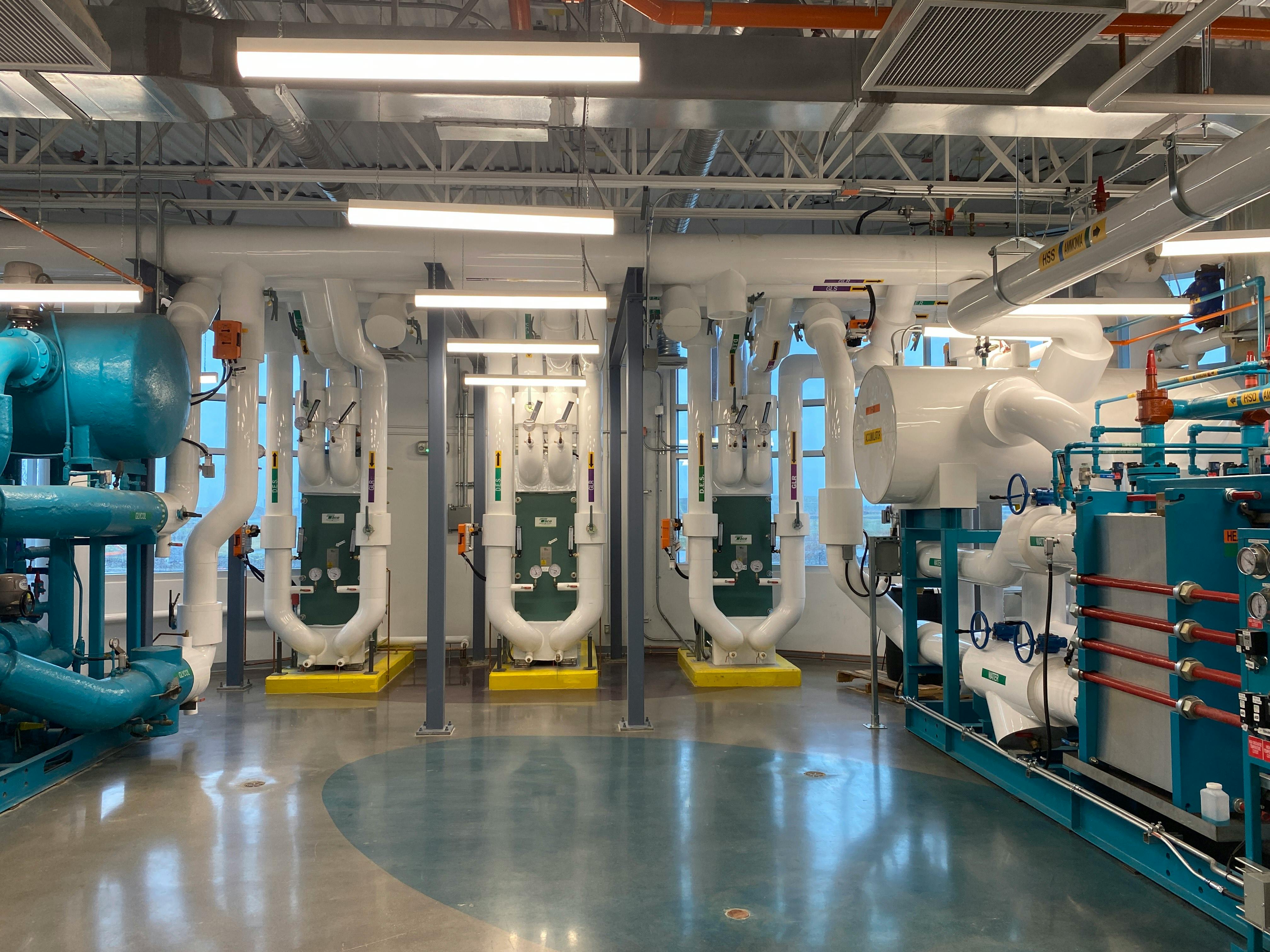 HVAC operations manager reviewing technician schedules, dispatch dashboards, inventory reports, and business performance metrics to improve operational efficiency and service profitability.