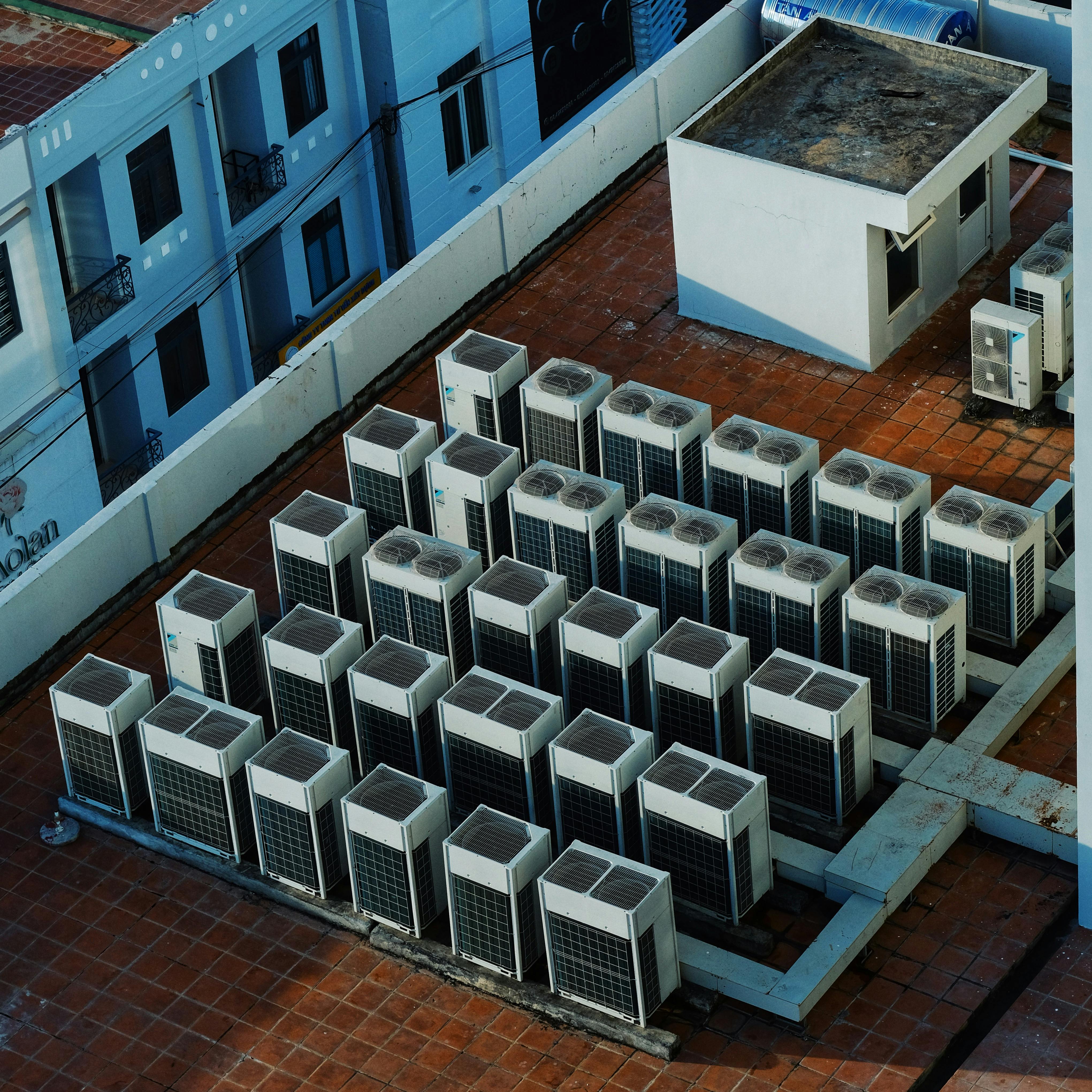 HVAC business owner reviewing operational dashboards, financial reports, technician performance metrics, customer management systems, and growth strategies for long-term business success.