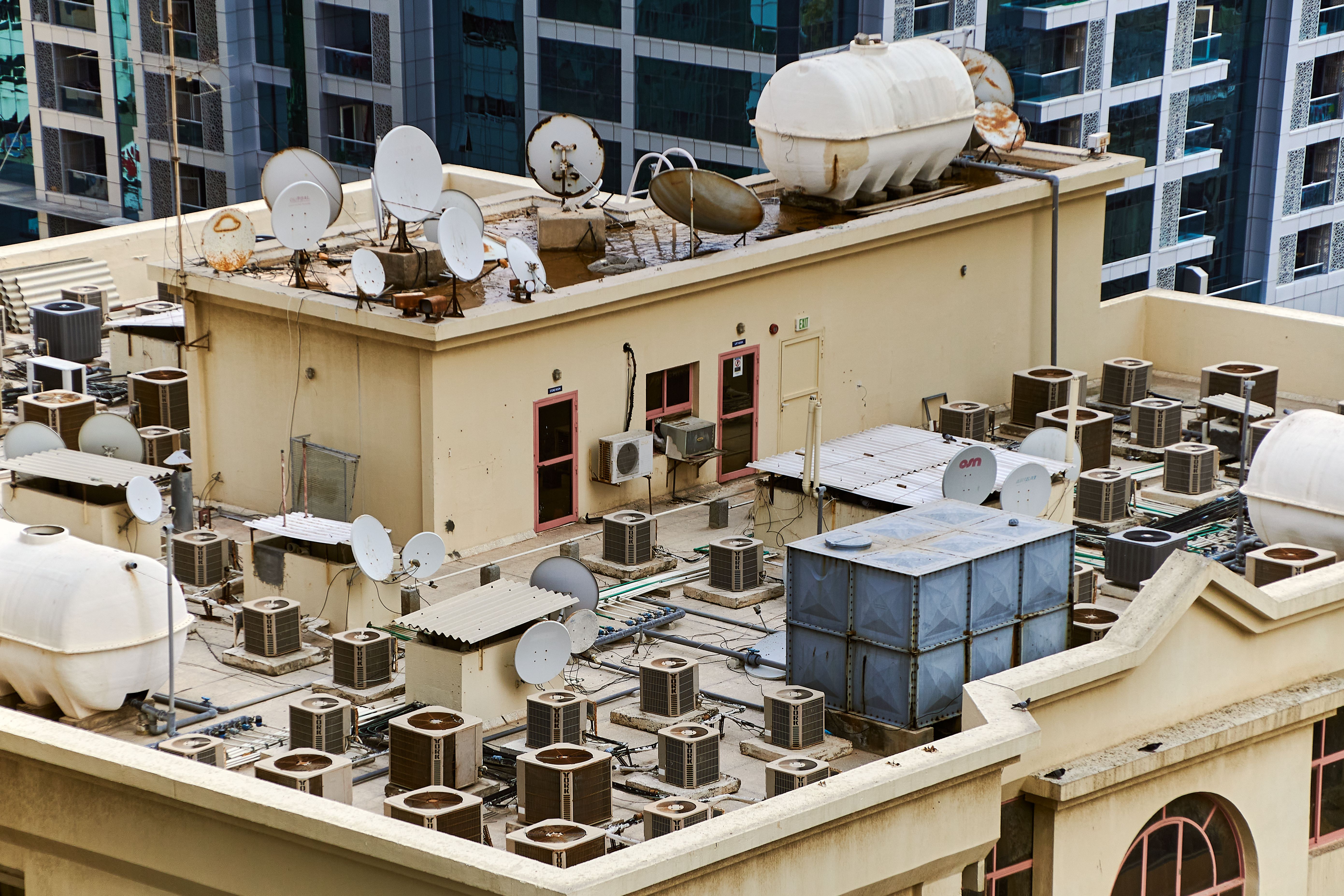 HVAC operations manager reviewing scheduling dashboards, technician workloads, dispatch planning, inventory tracking, and performance metrics to build a scalable HVAC service business.
