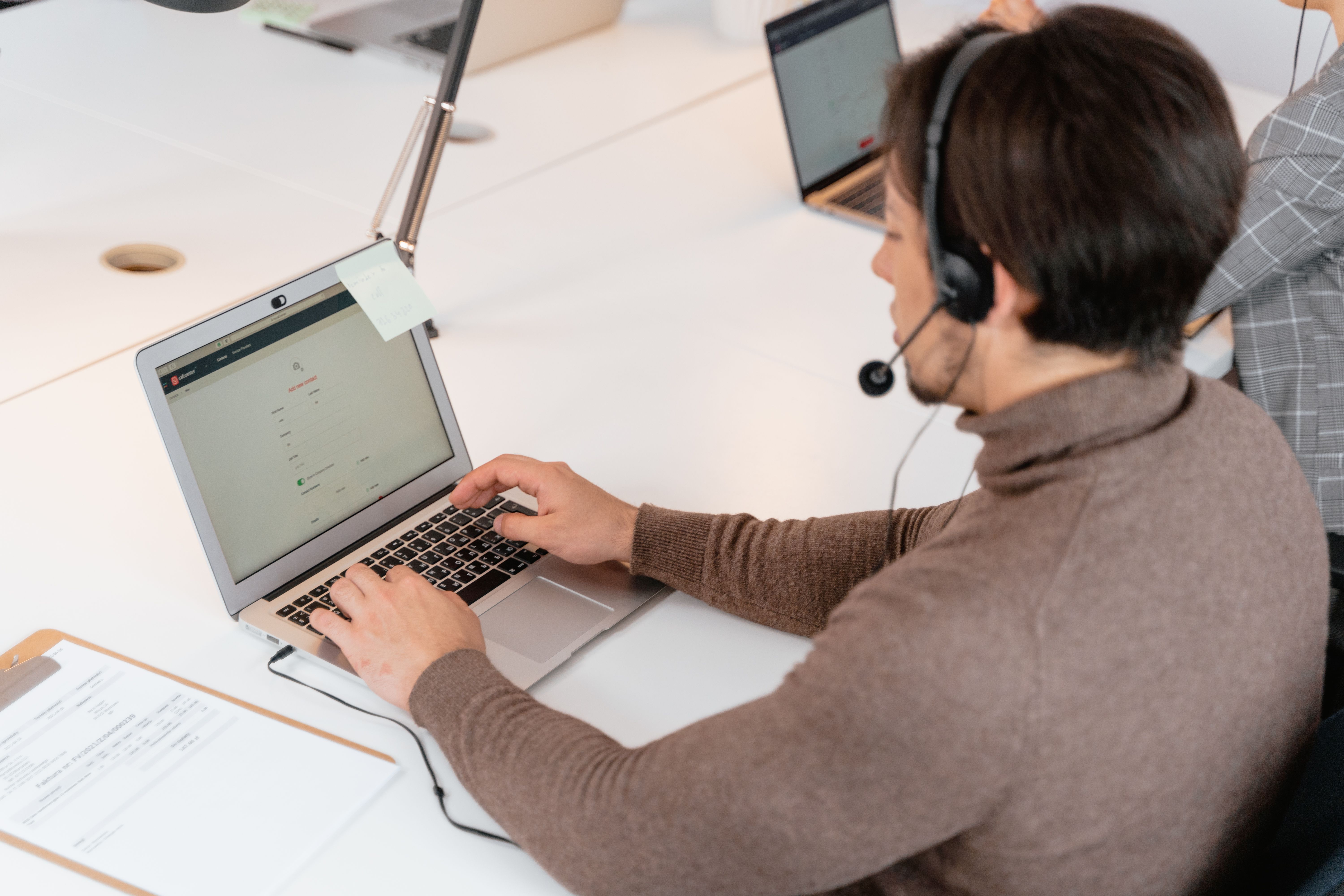 software developer person sitting on table 7709171