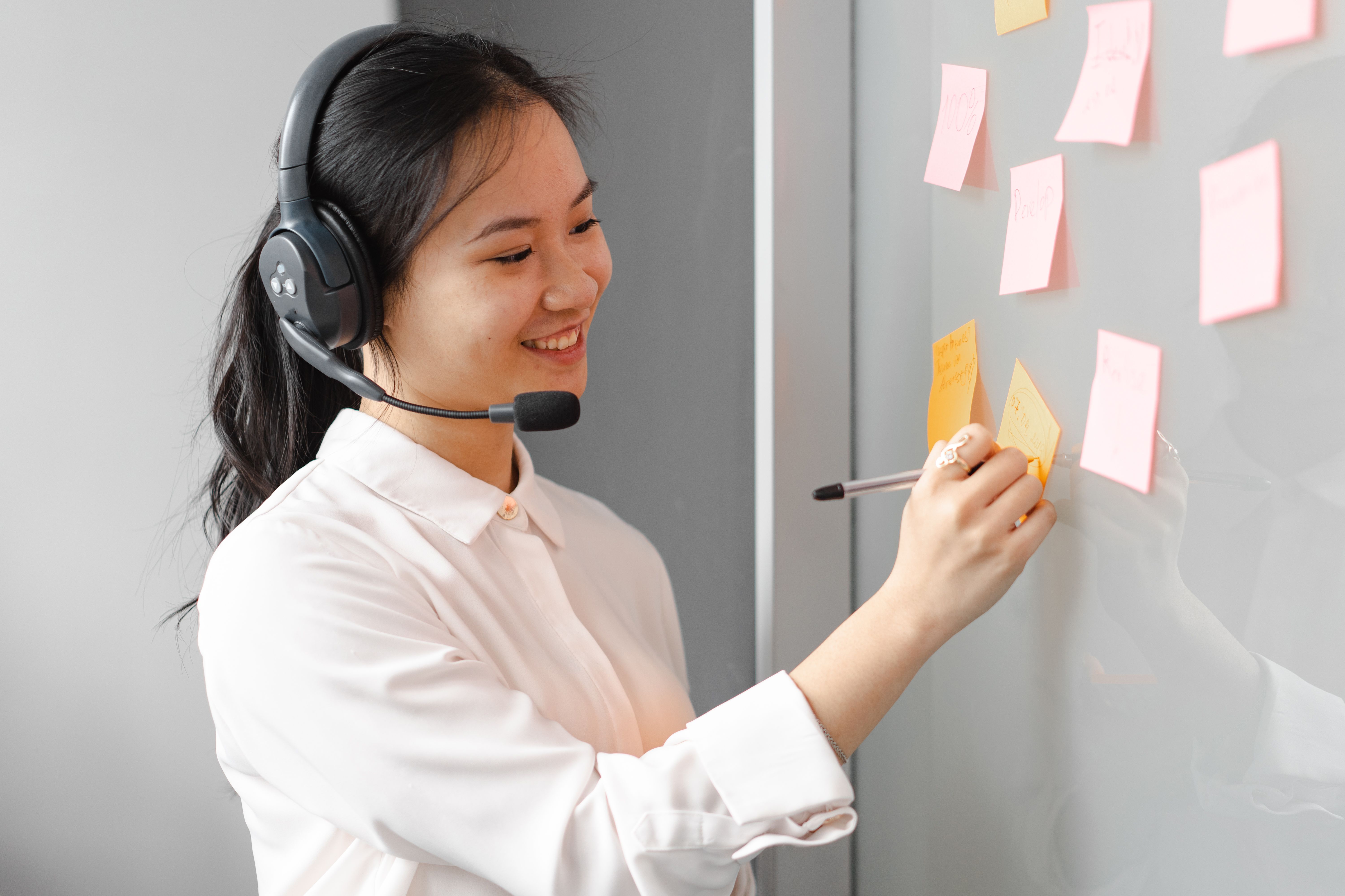 girls girls writes on sticky notes