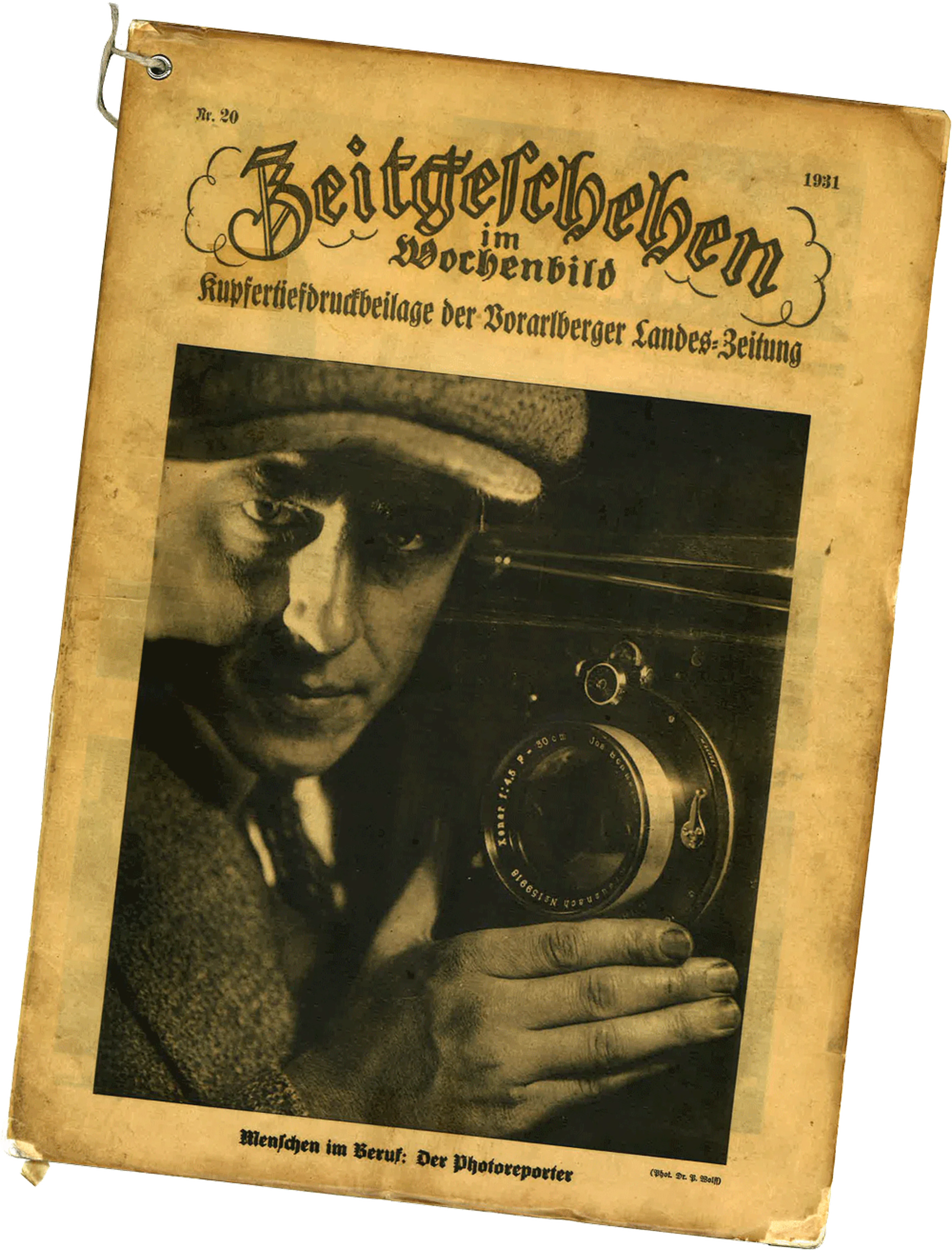 Titelbild einer Zeitschrift aus dem Jahr 1931, auf dem ein Fotograf mit einer Kamera zu sehen ist, mit dem Titel „Zeitgeschehen in Wochenbild“.