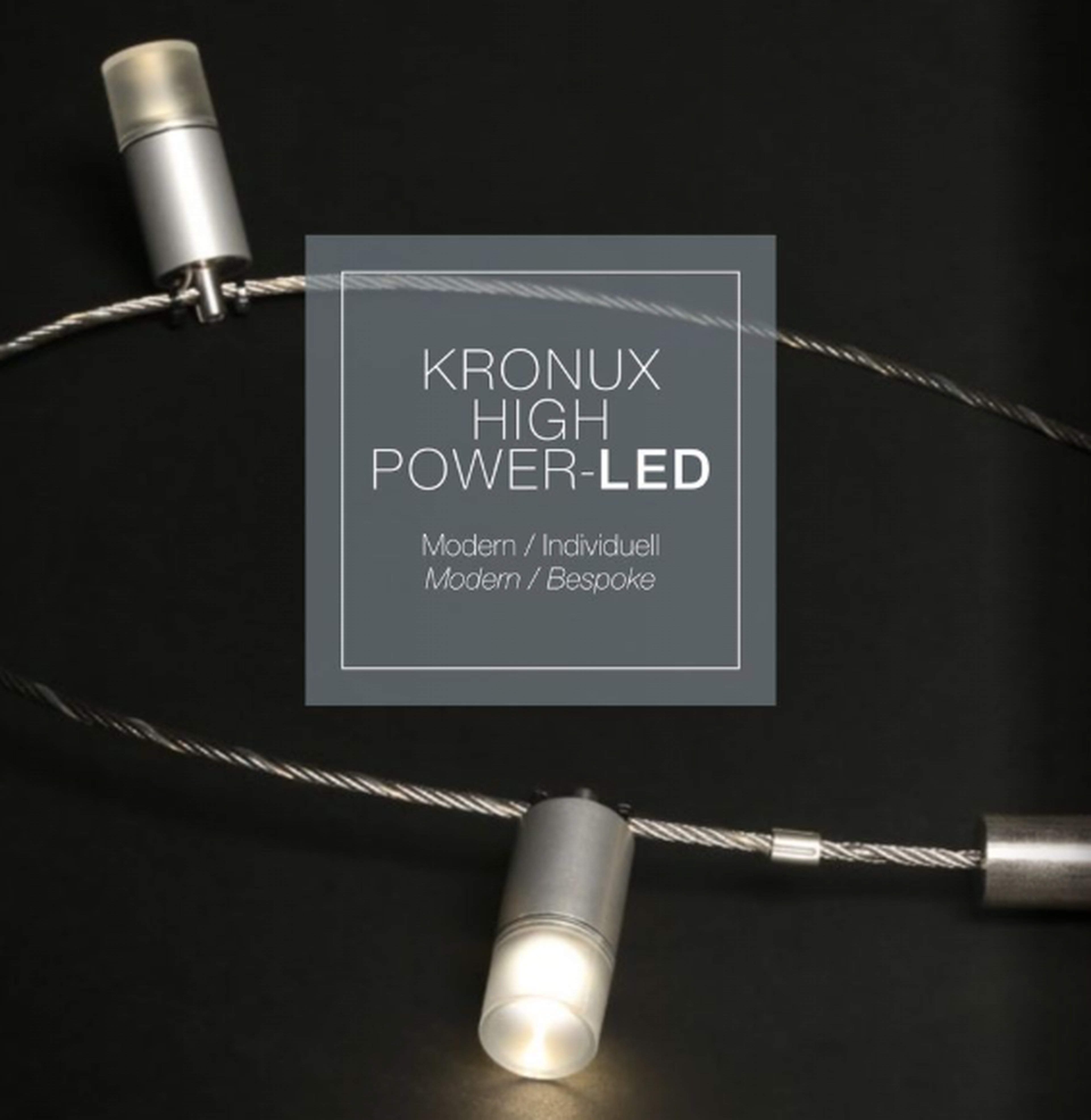 Zwei moderne Kronux High Power-LEDs an Drahtseilen, mit der Aufschrift "Modern / Individuell, Modern / Bespoke".