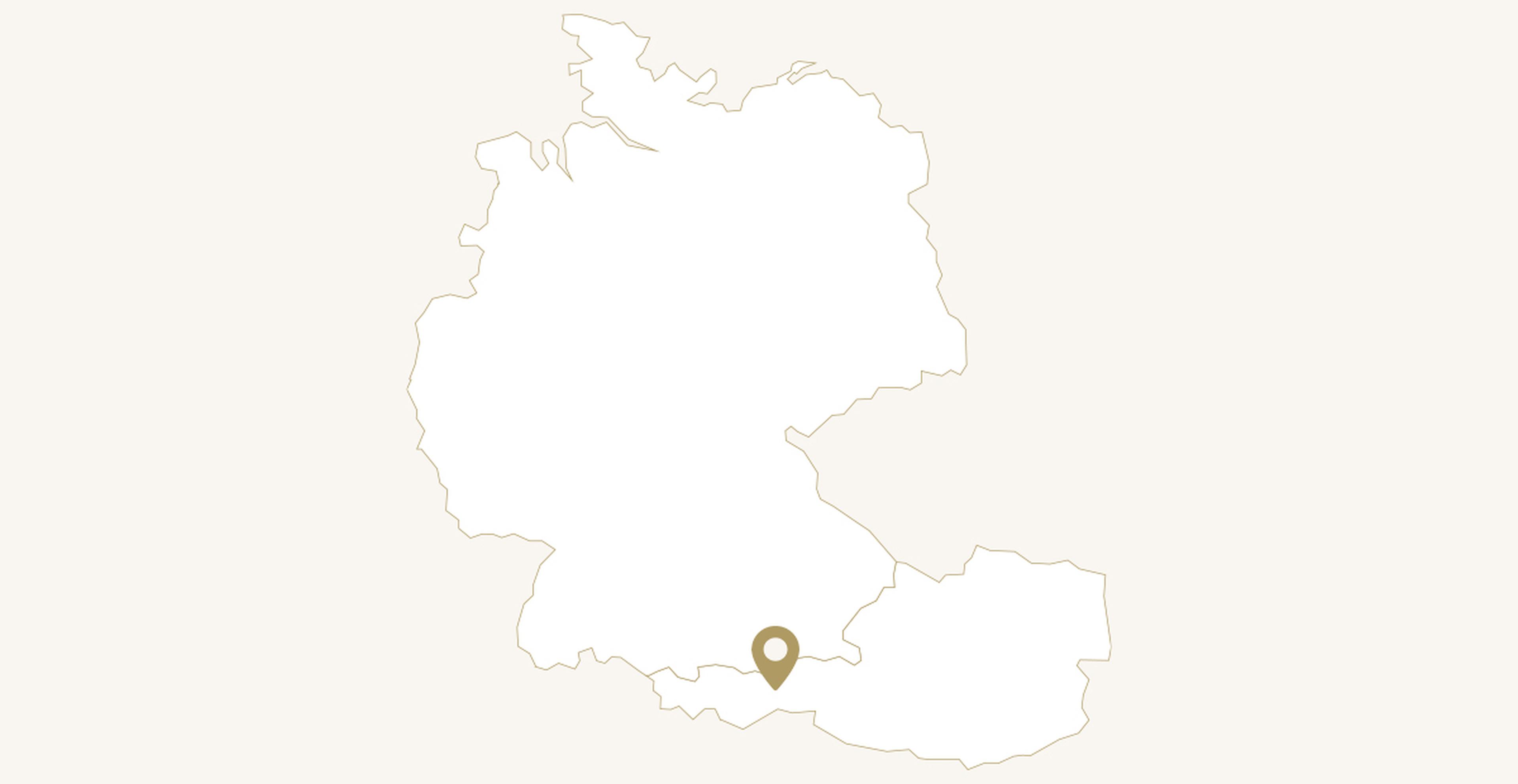 Umrisskarte von Deutschland und Österreich mit einem Marker im südlichen Österreich.