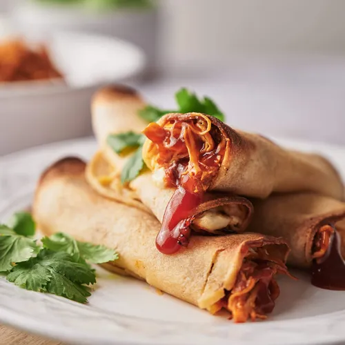 Crispy honey BBQ chicken taquitos