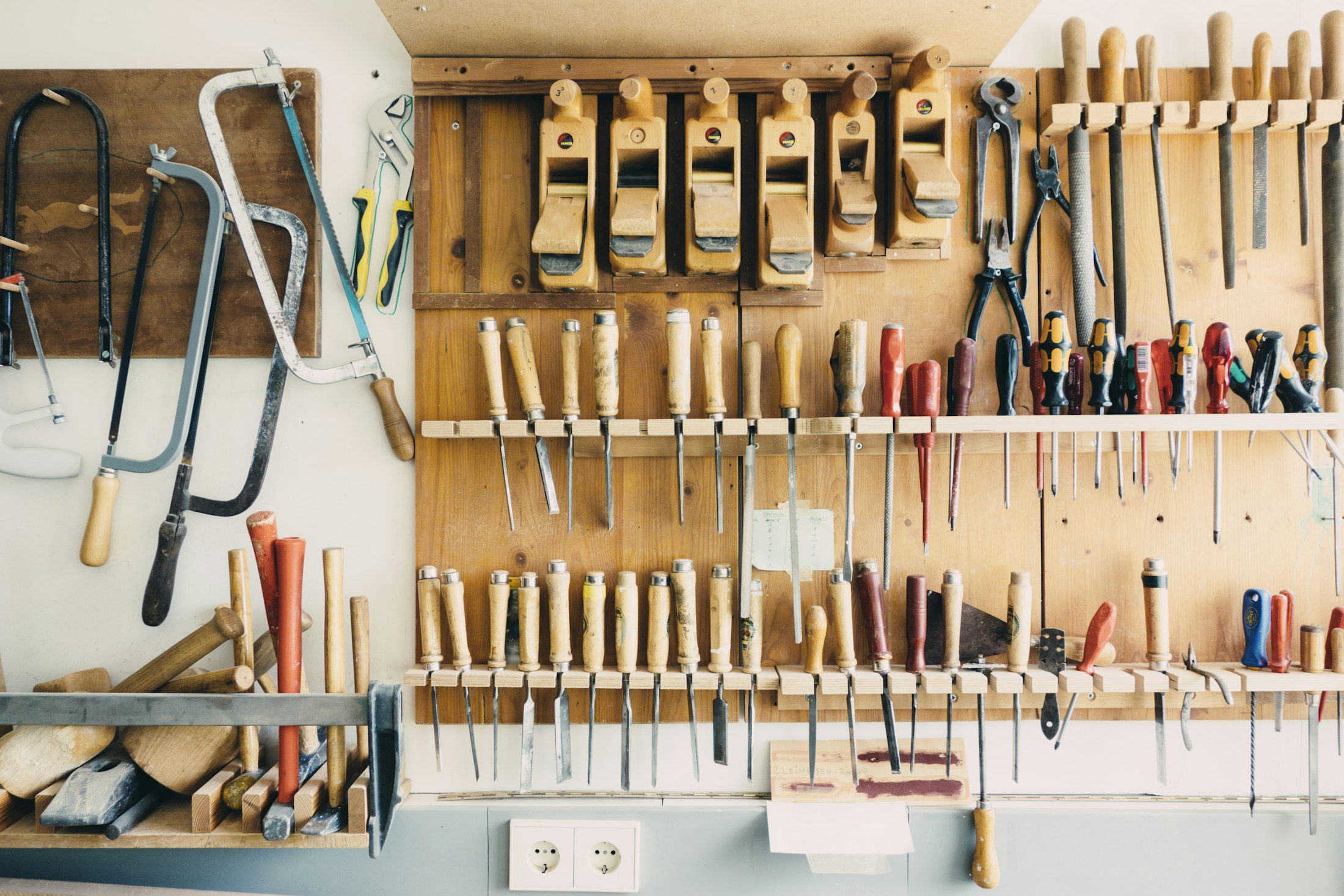 A workshop wall of hand tools