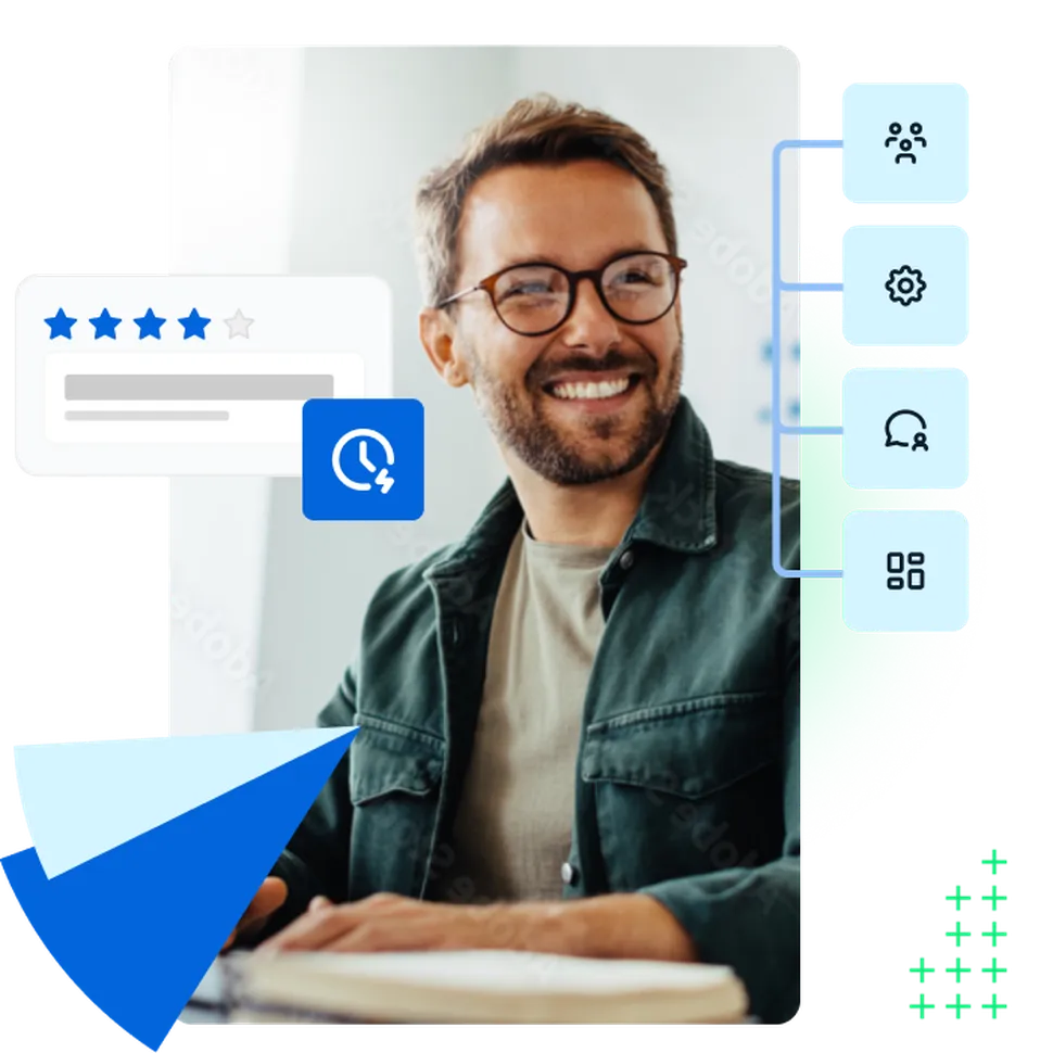 Man working on an office smiling in front of a computer integrating surveys in  his software enviroment