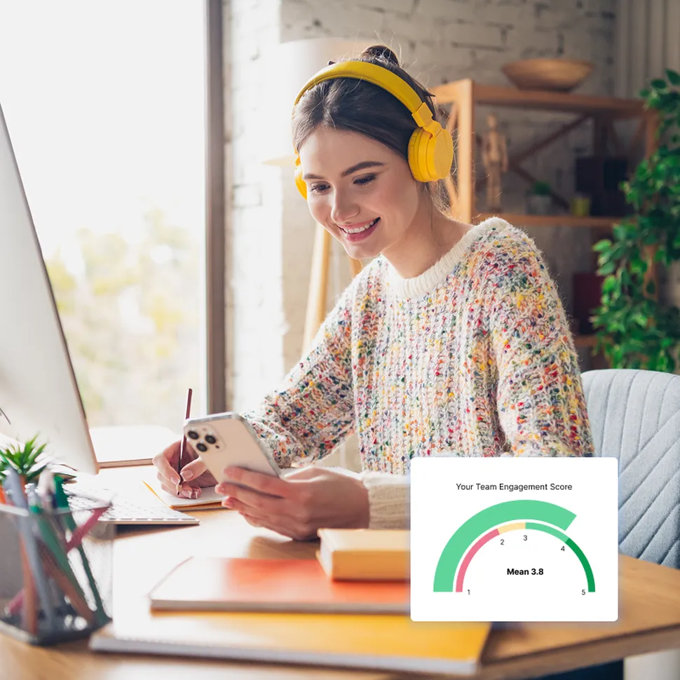 HR Manager working in front of a desk listening to employee feedback
