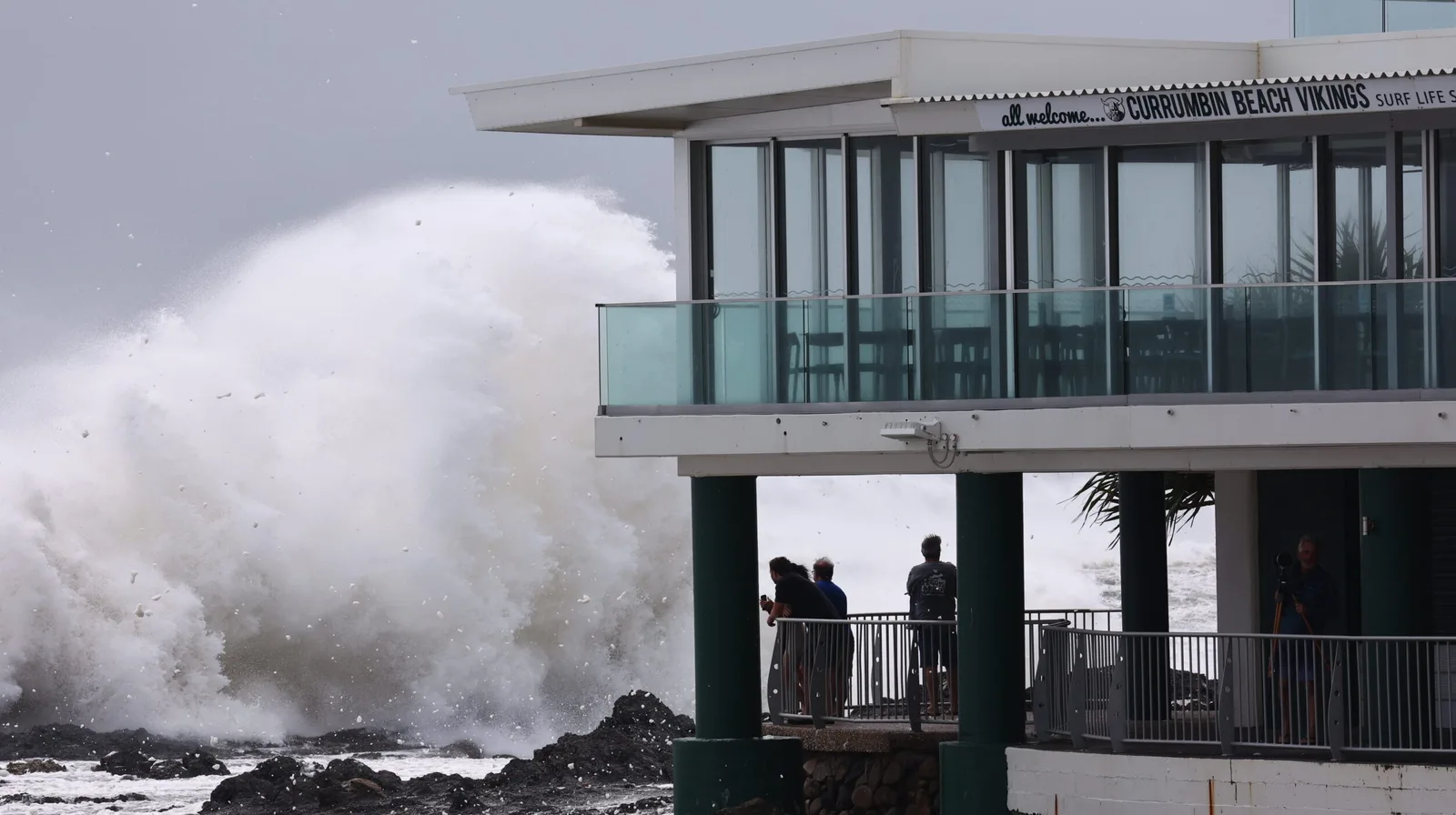 A Gold Coast surf club under threat from massive waves during a cyclone.