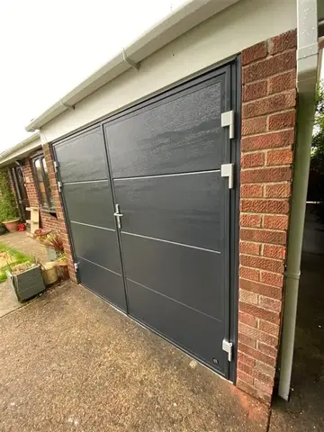 Insulated side-hinged garage door installed in Newark