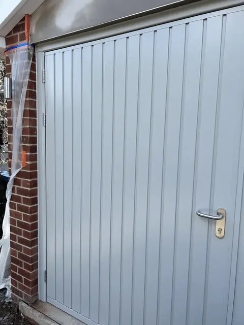 Side-hinged garage door in grey, single skin, installed in Grantham