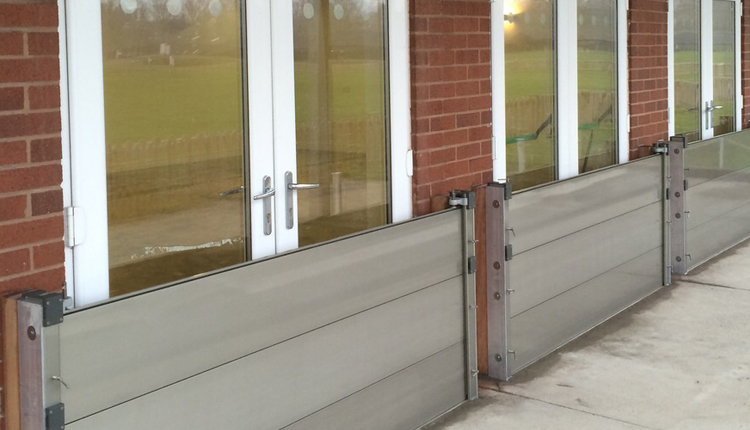 Flood barrier installed across a doorway providing watertight protection