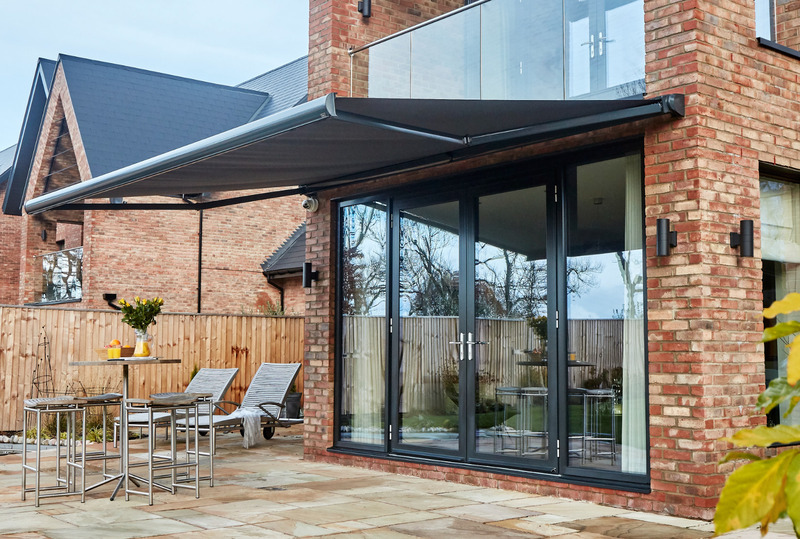 Patio with a retractable awning providing shade over outdoor seating