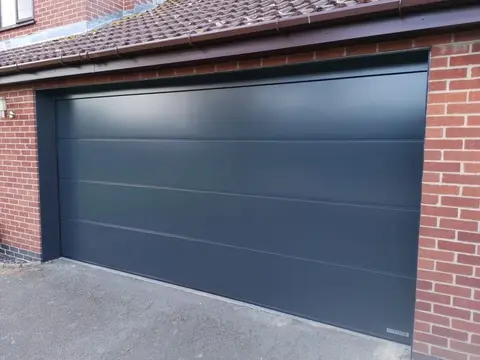 Sectional garage door with L-Rib design in anthracite grey, installed in Grantham