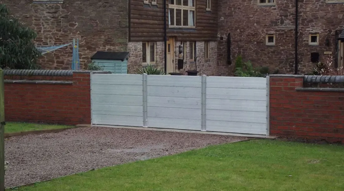 Flood barrier demonstration showing water held back from a doorway