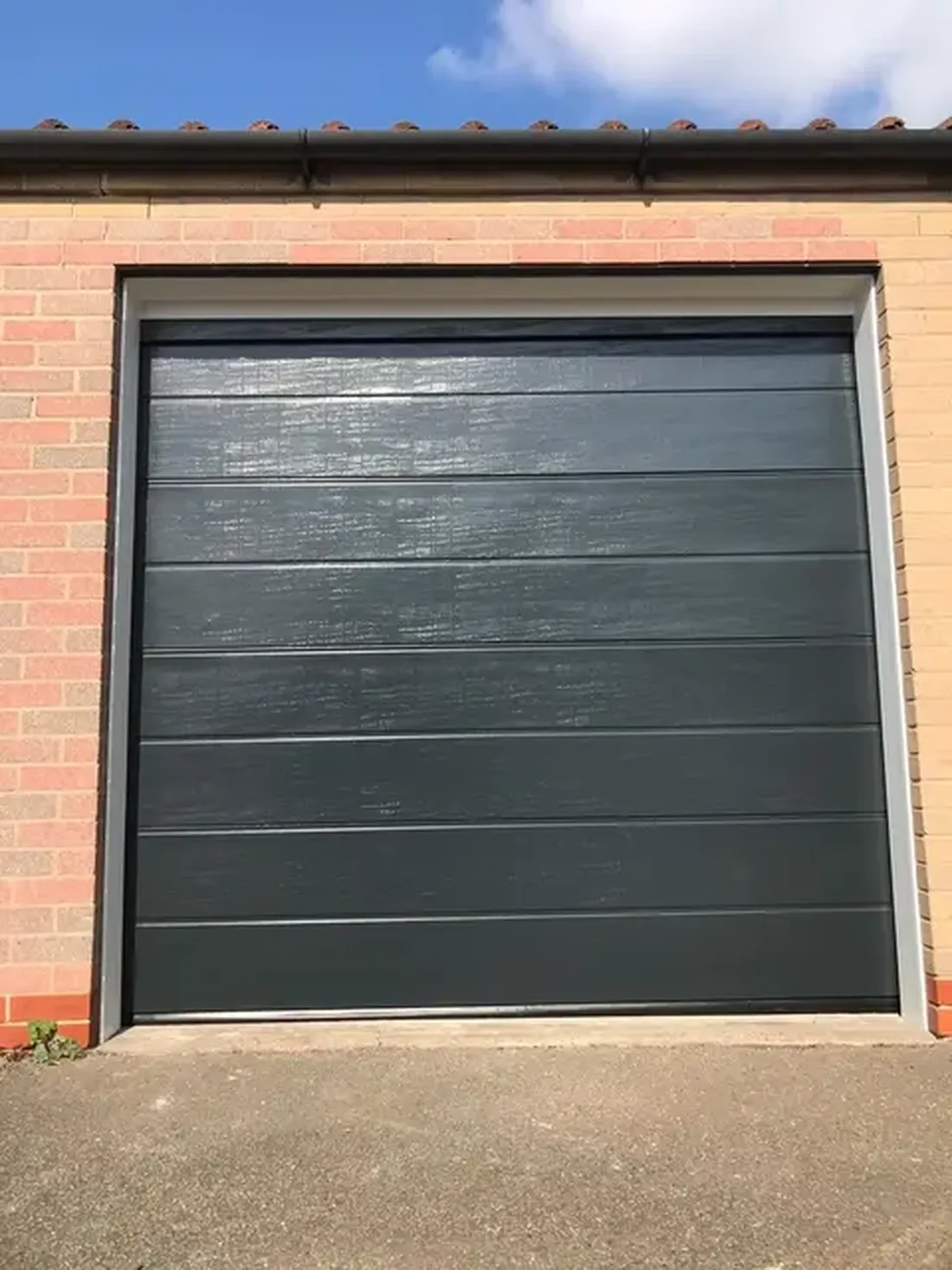 Sectional garage door with M-Rib design in anthracite, installed in Nottinghamshire